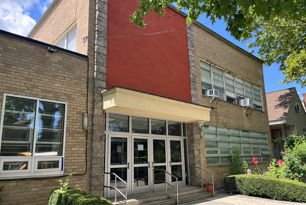 Building entrance at 71-64 168th Street; signage digitally removed