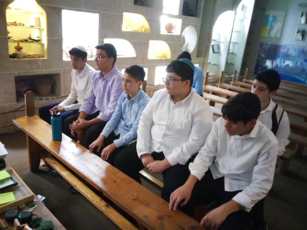 Students listening together during a school outing